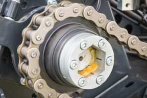 Metal chain and gear as part of agricultural and industrial machine. Technology